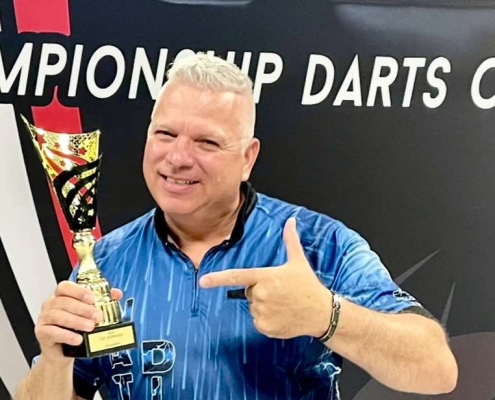 Darryl Christie holds trophy after CDC Showcase win