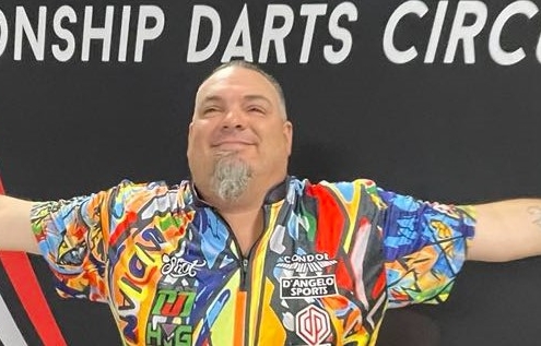Stowe Buntz spreads his arms wide, celebrating a victory with the DJD Duel trophy