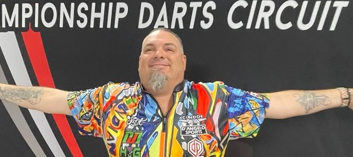 Stowe Buntz spreads his arms wide, celebrating a victory with the DJD Duel trophy
