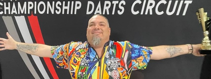 Stowe Buntz spreads his arms wide, celebrating a victory with the DJD Duel trophy